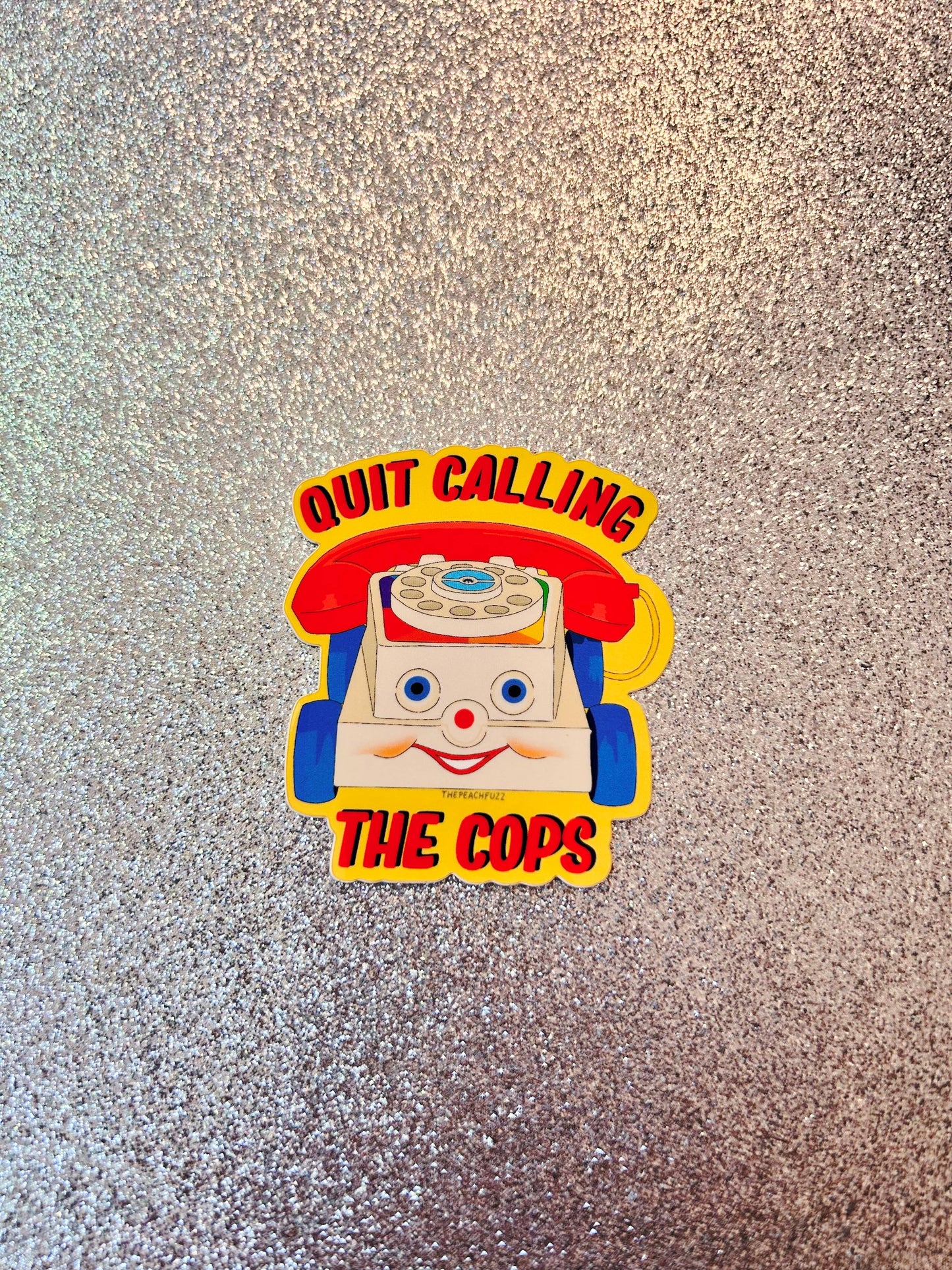The Peach Fuzz• “Quit Calling The Cops” Toy Phone Sticker