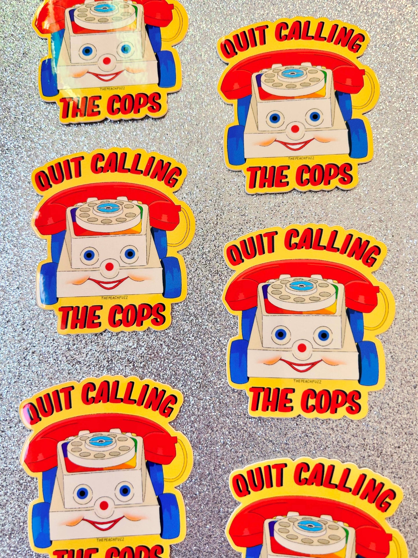 The Peach Fuzz• “Quit Calling The Cops” Toy Phone Sticker