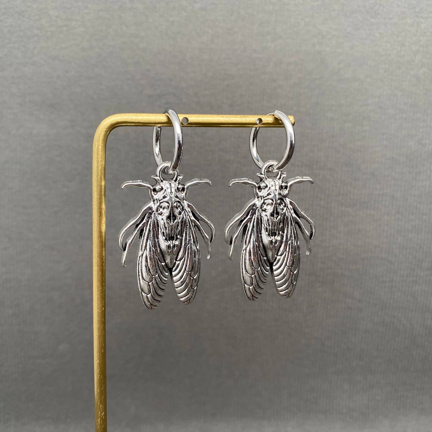 Silver Tone Moth Huggie Earrings