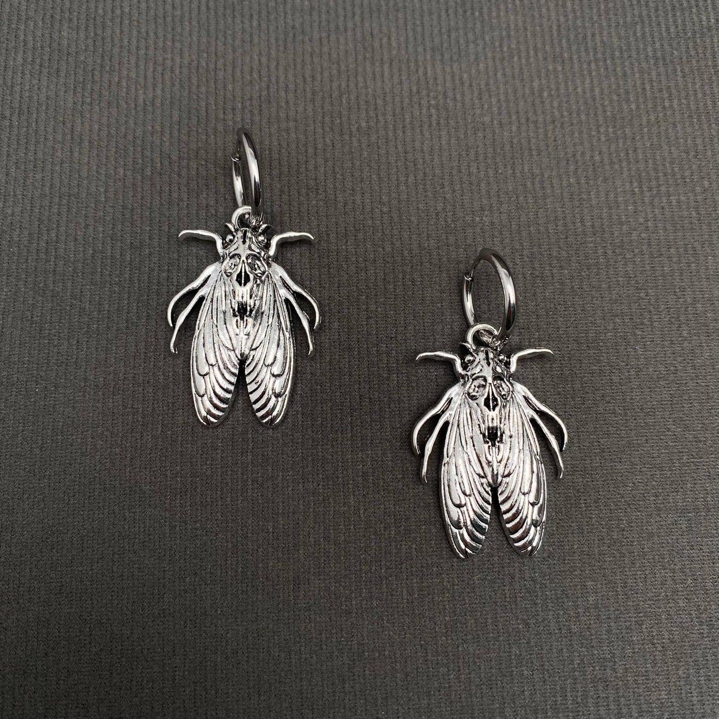 Silver Tone Moth Huggie Earrings