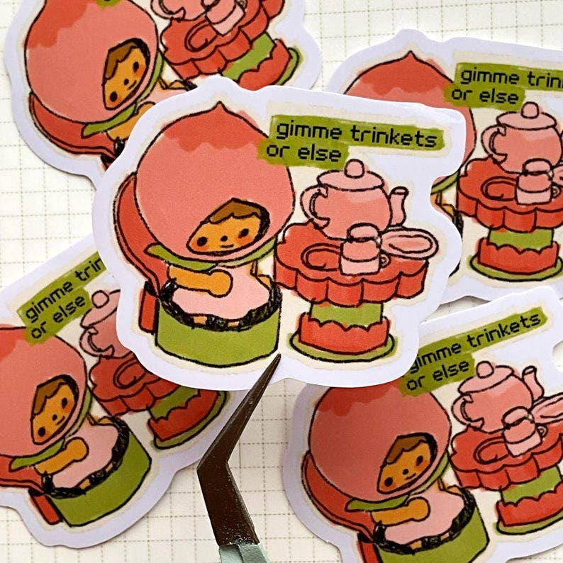 W0nkk0 • "Gimme Trinkets Or Else" Kawaii Kewpie Trinket Vinyl Sticker