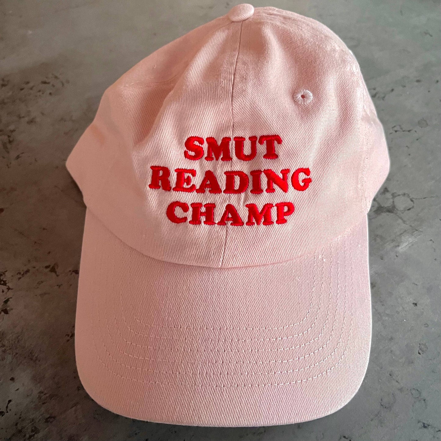 The Silver Spider • “Smut Reading Champ” Baseball Dad Hat, Pink