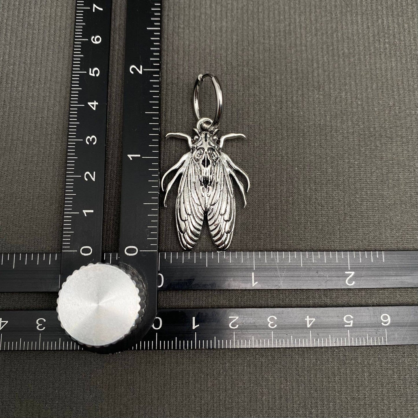 Silver Tone Moth Huggie Earrings