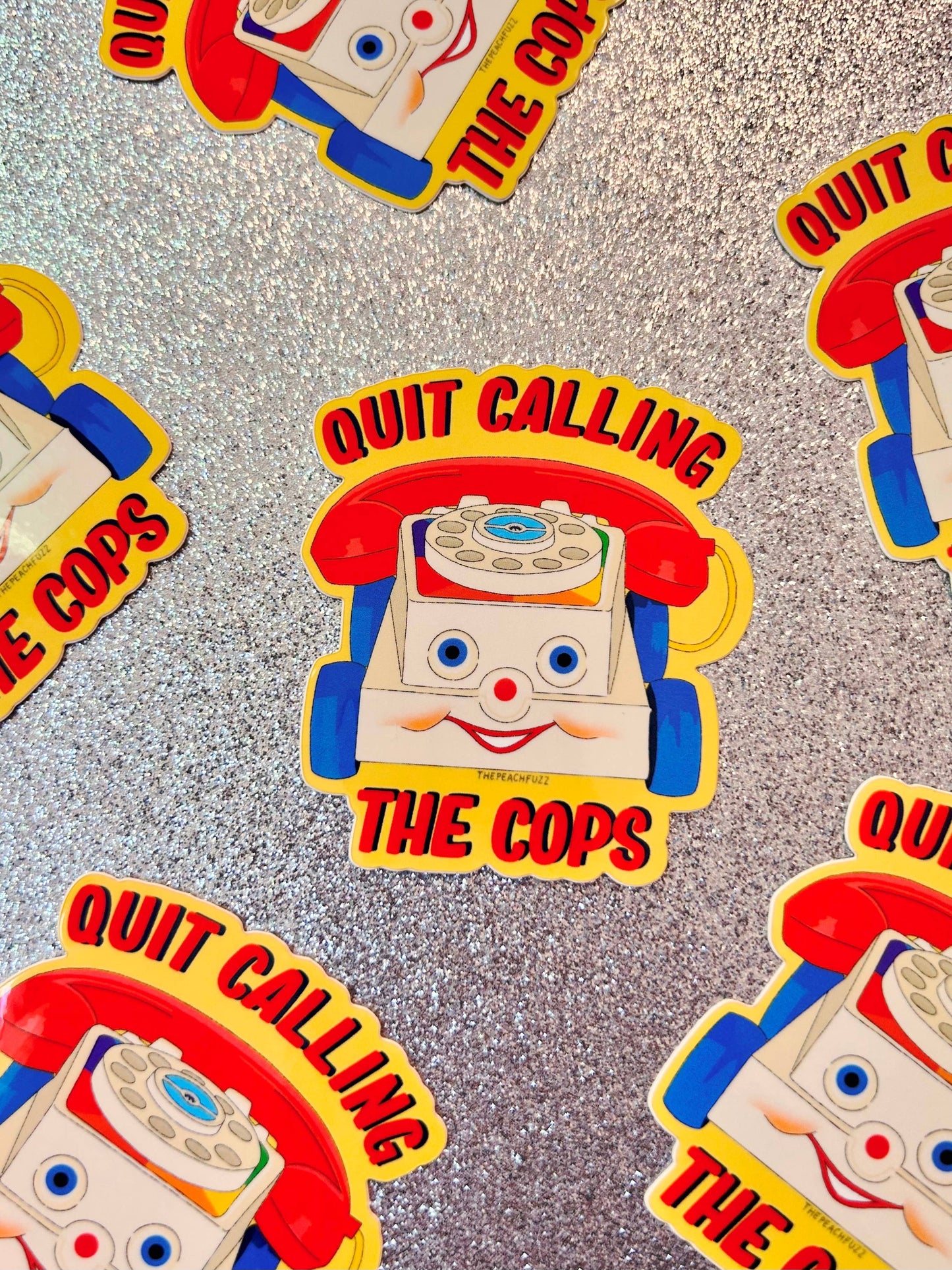 The Peach Fuzz• “Quit Calling The Cops” Toy Phone Sticker