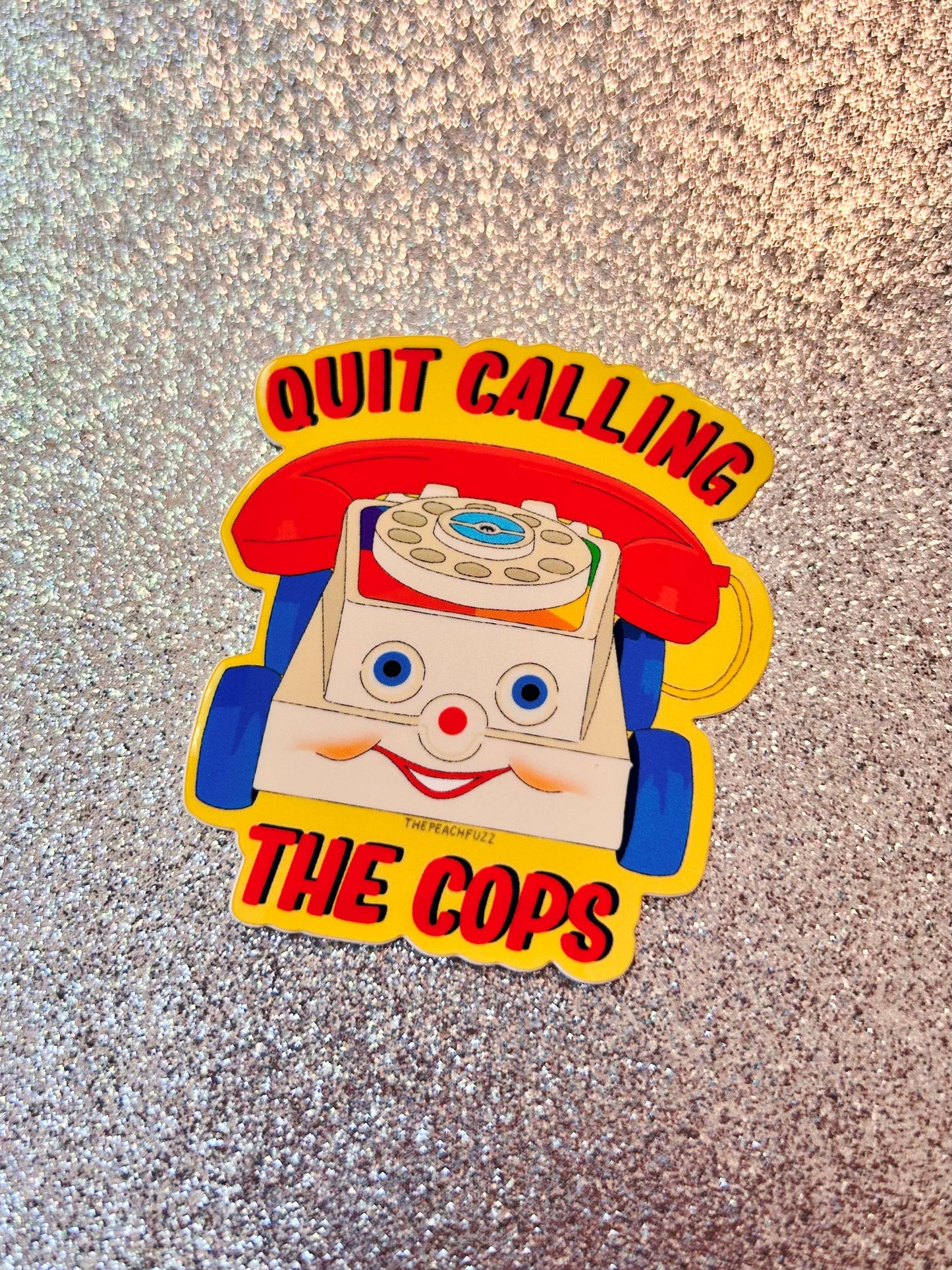 The Peach Fuzz• “Quit Calling The Cops” Toy Phone Sticker