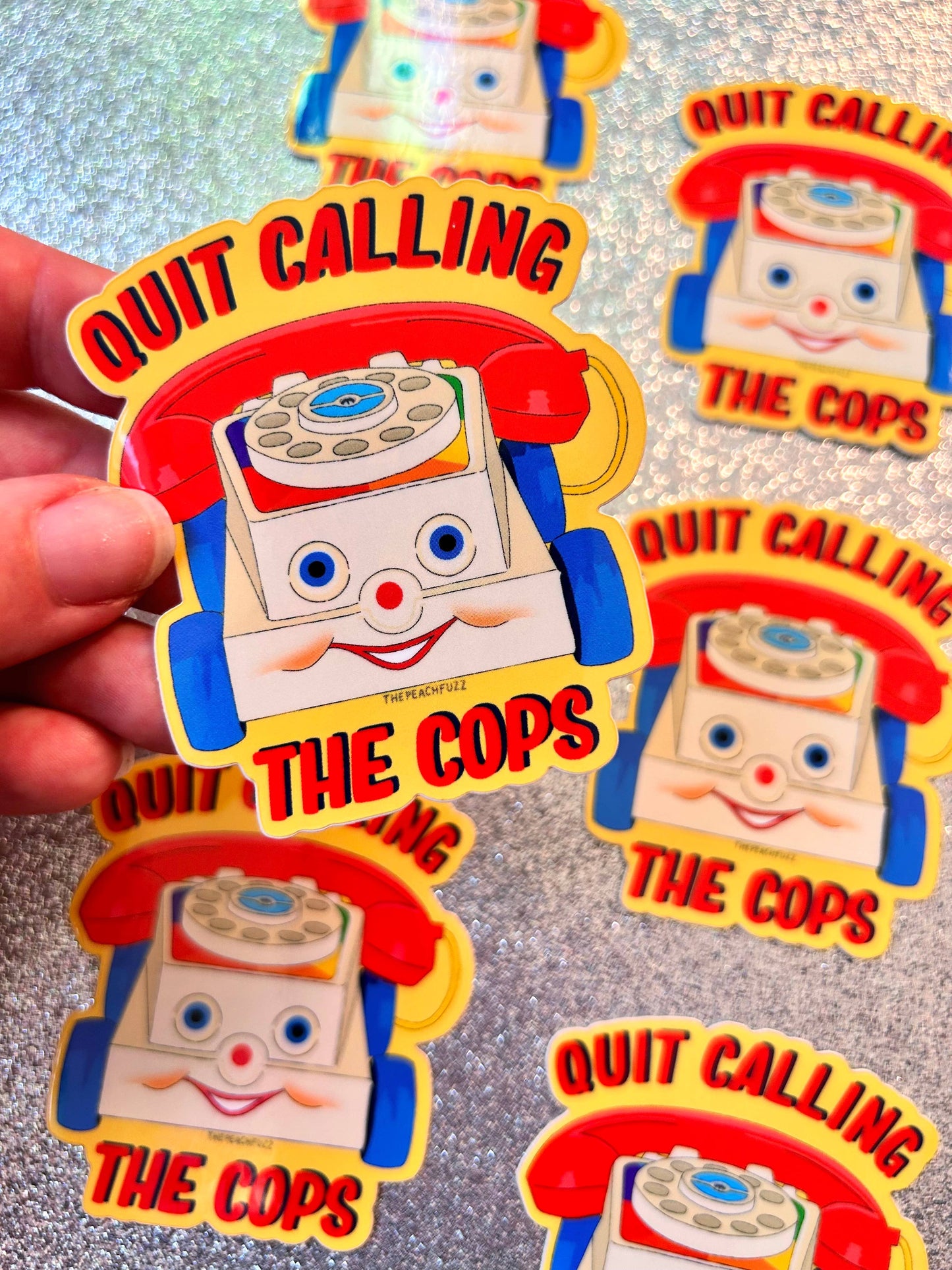The Peach Fuzz• “Quit Calling The Cops” Toy Phone Sticker