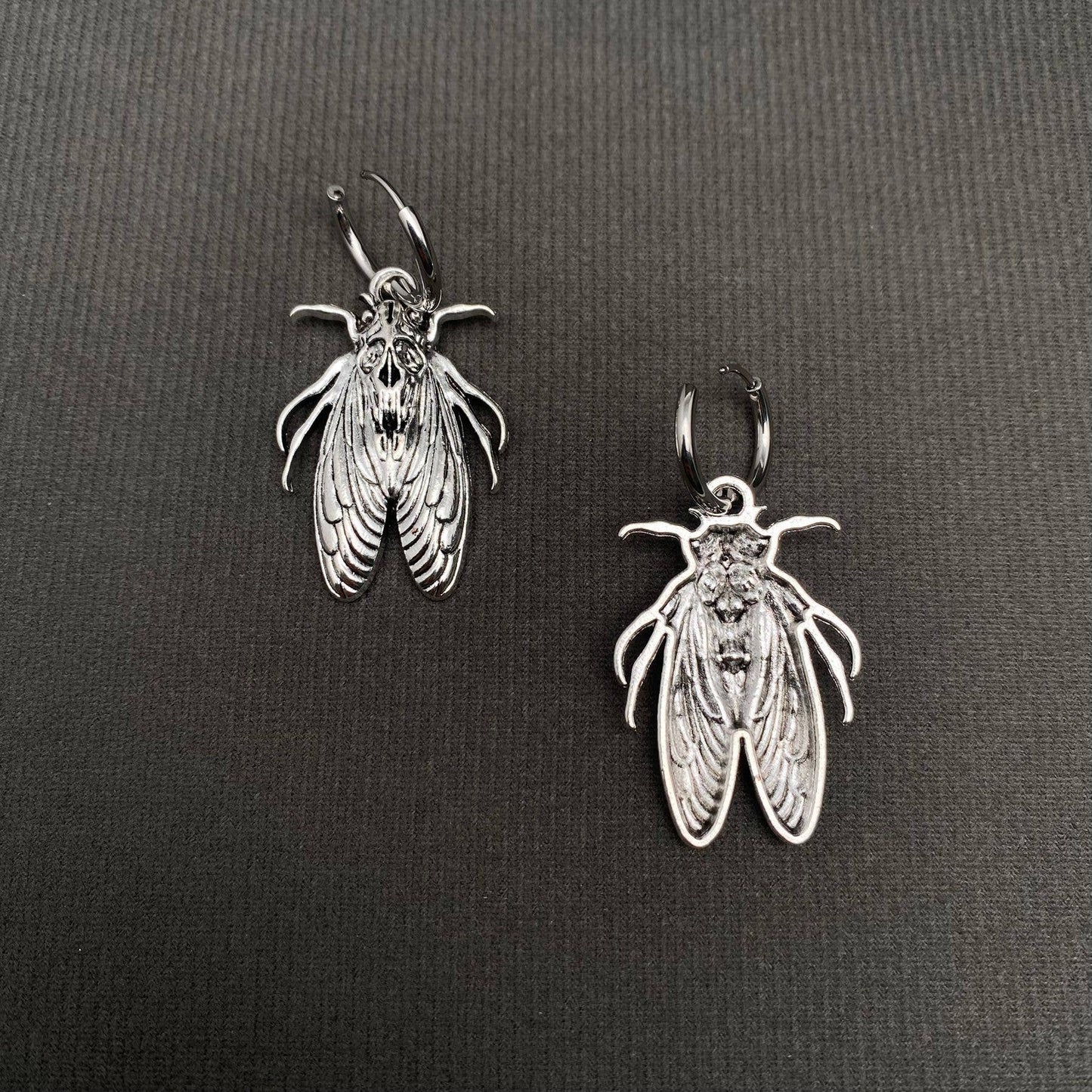 Silver Tone Moth Huggie Earrings
