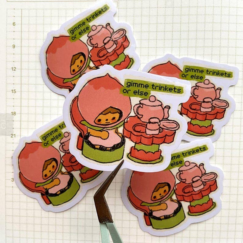 W0nkk0 • "Gimme Trinkets Or Else" Kawaii Kewpie Trinket Vinyl Sticker
